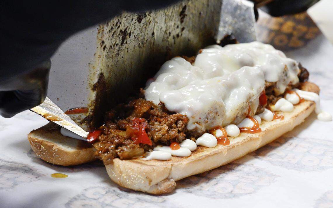 A Philly chopped cheese sandwich topped with Provolone cheese is prepared at Chop Cheese Bodega on Blackstone Ave. near Bullard Ave. Monday, Jan. 12, 2026 in Fresno. Chop Cheese Bodega has been named a fan favorite.