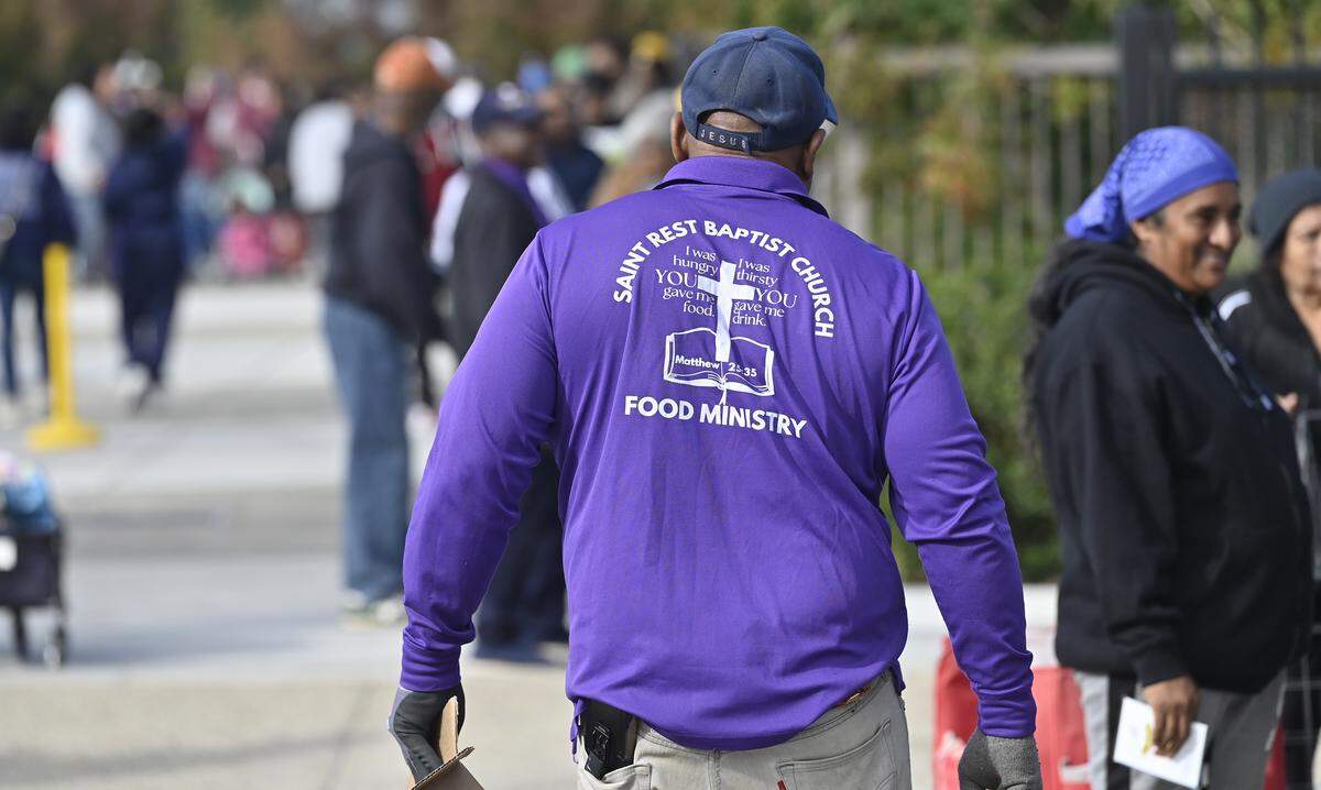 Organizers estimted over 200 people lined up during a food distribution event held at Saint Rest Baptist Church Thursday, Nov. 6, 2025 in West Fresno.