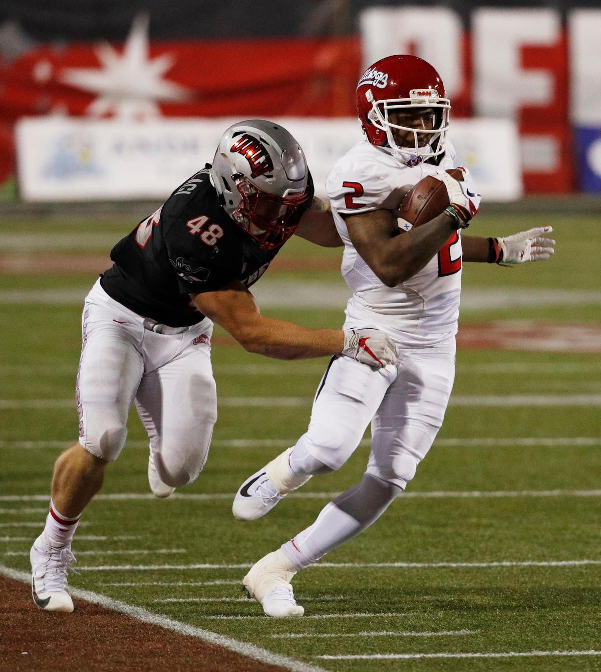 Fresno State wideout Michiah Quick tries to escape a tackle by UNLV linebacker Bailey Laolagi (48) in the Bulldogs’ 48-3 victory over the Rebels at Sam Boyd Stadium in Las Vegas Saturday, Nov. 3, 2018. Quick had five receptions for 49 yards in his second game since returning from a foot injury.