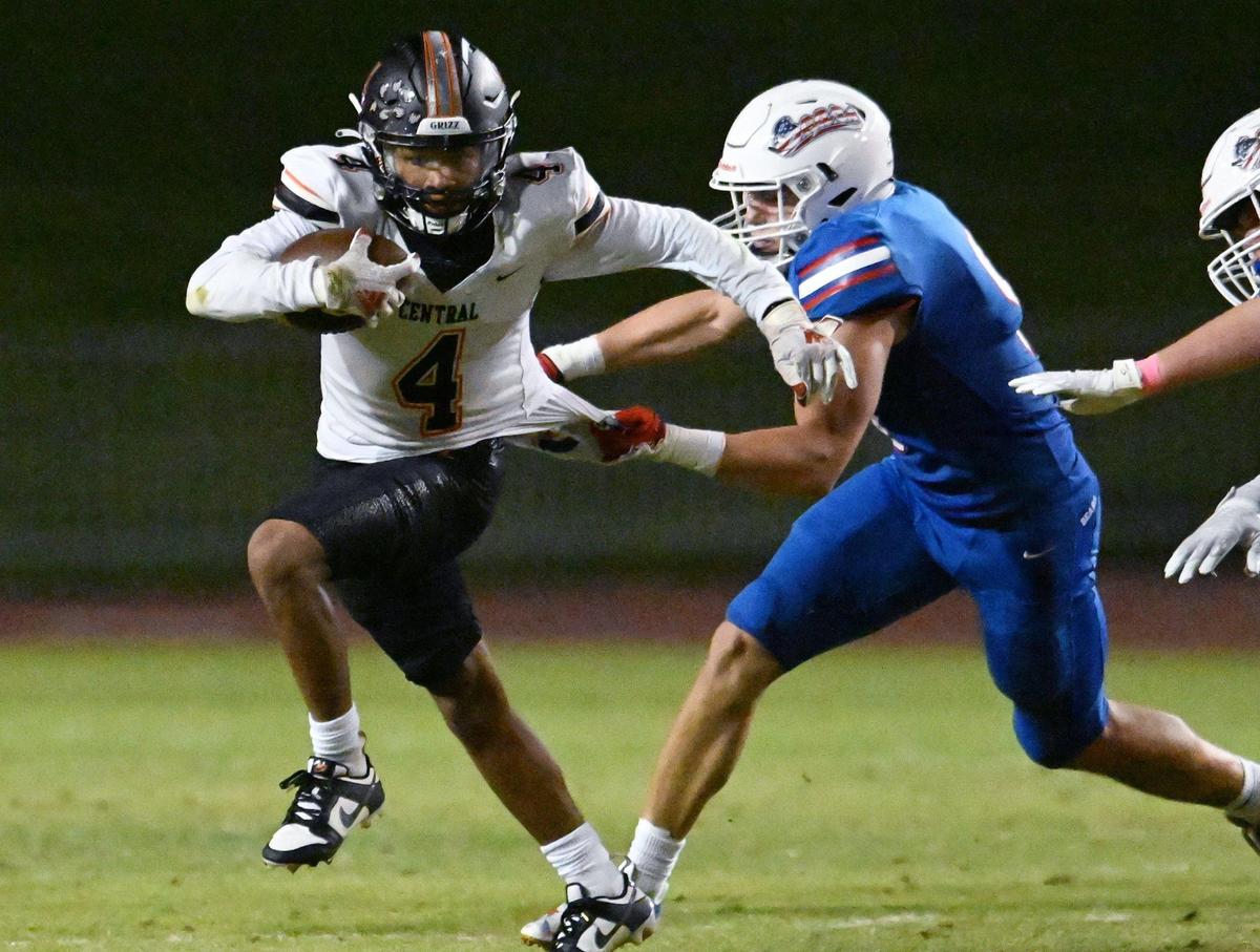 Buchanan’s Logan Studt, right, grabs ahold of Central’s David Bell, left, in first half action Thursday, Oct. 5, 2023 in Clovis.