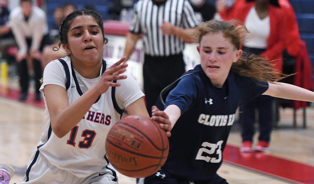 San Joaquin Memorial’s Saiya Sidhu, left, and Clovis East’s Allie Madron, right, chase a loose ball Friday, Feb. 18, 2022 in Fresno.