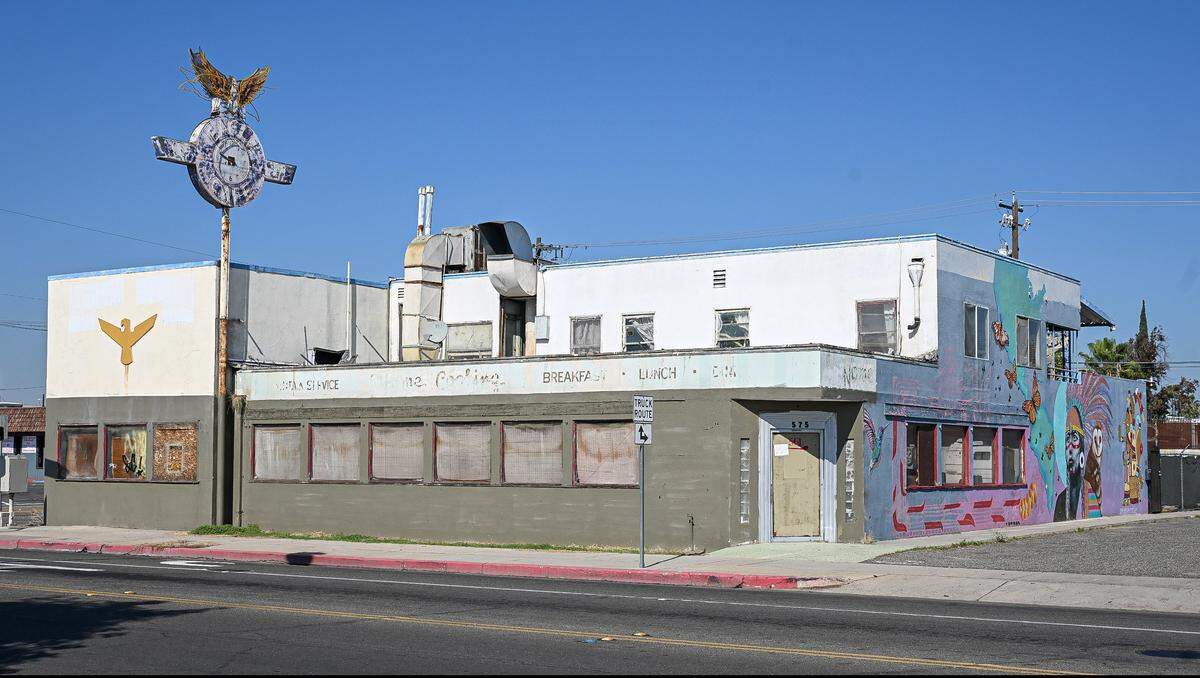 The former Eagle Cafe building, located on Divisadero near H Street in downtown Fresno, still looks similar to when it ran a bustling lunchtime business back in the 1940s and 1950s near old Highway 99. It has been closed since 1978 but still features the eagle clock flying at the top of a pole on its south side.