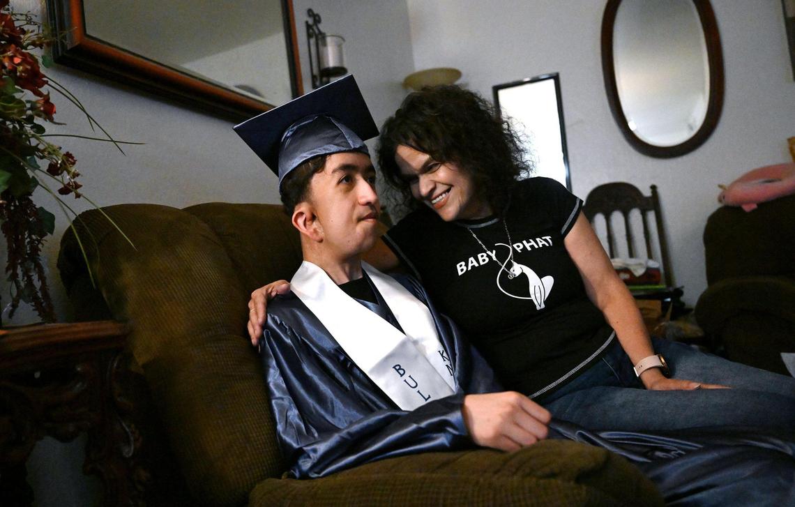 Cruz Hernandez wears his cap and gown as he prepares to graduate that night from Bullard High School Tuesday, June 10, 2025 in Fresno. Cruz and his mother talked about the their trip to Washington DC the next day to advocate for Medical which helped pay for Cruz’ fight against a rare disease.