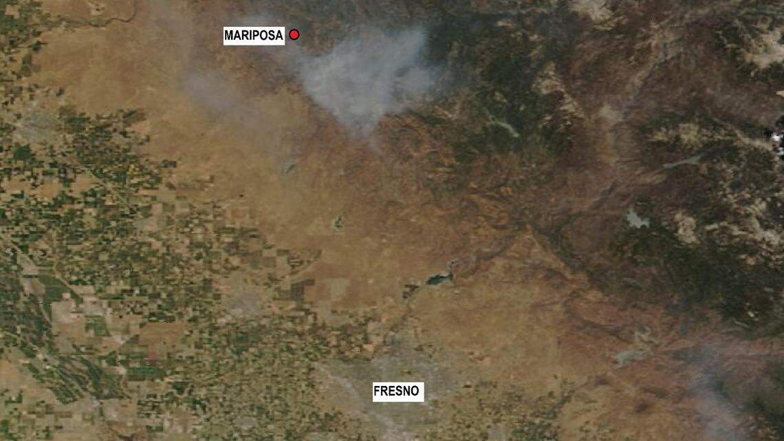 A NASA satellite image of the central San Joaquin Valley and central Sierra Nevada from July 12, 2021, shows a plume of smoke emanating from the River Fire in Mariposa County and eastern Madera County. Wildfire smoke prompted the San Joaquin Valley Air Pollution Control District to issue a health caution for Valley residents.