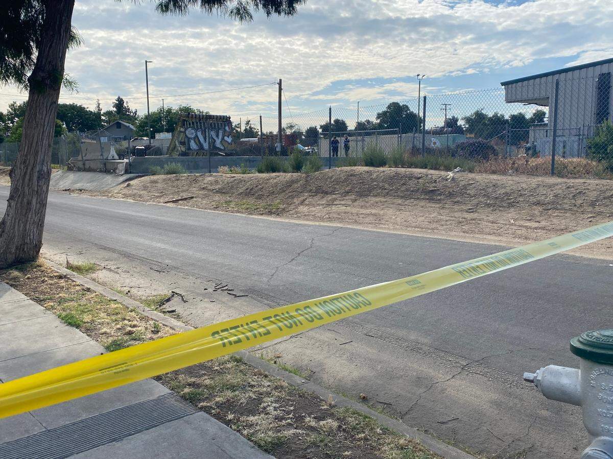 Fresno police investigate a bridge and canal where a body was found between downtown and the Tower District on Monday, June 12, 2023.