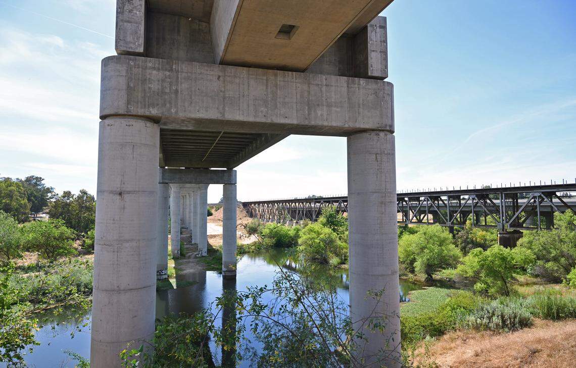 The High Speed Rail project is seen spanning the San Joaquin River with Freeway 99 in the background, seen during a tour of HSR work Wednesday, April 15, 2026 in Fresno.