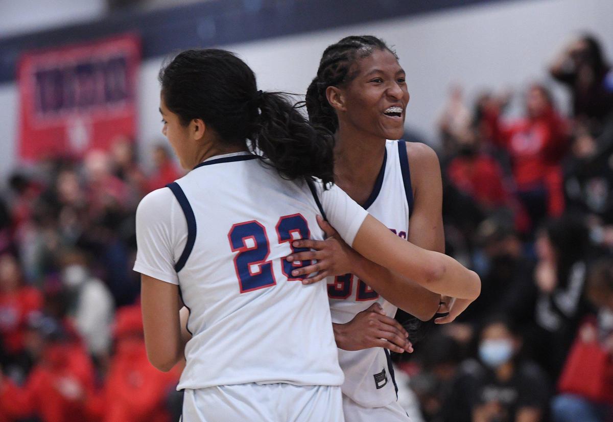 San Joaquin Memorial’s Gabby Ramos, left, and Meadow Roland, right, as they take on Clovis East Friday, Feb. 18, 2022 in Fresno.