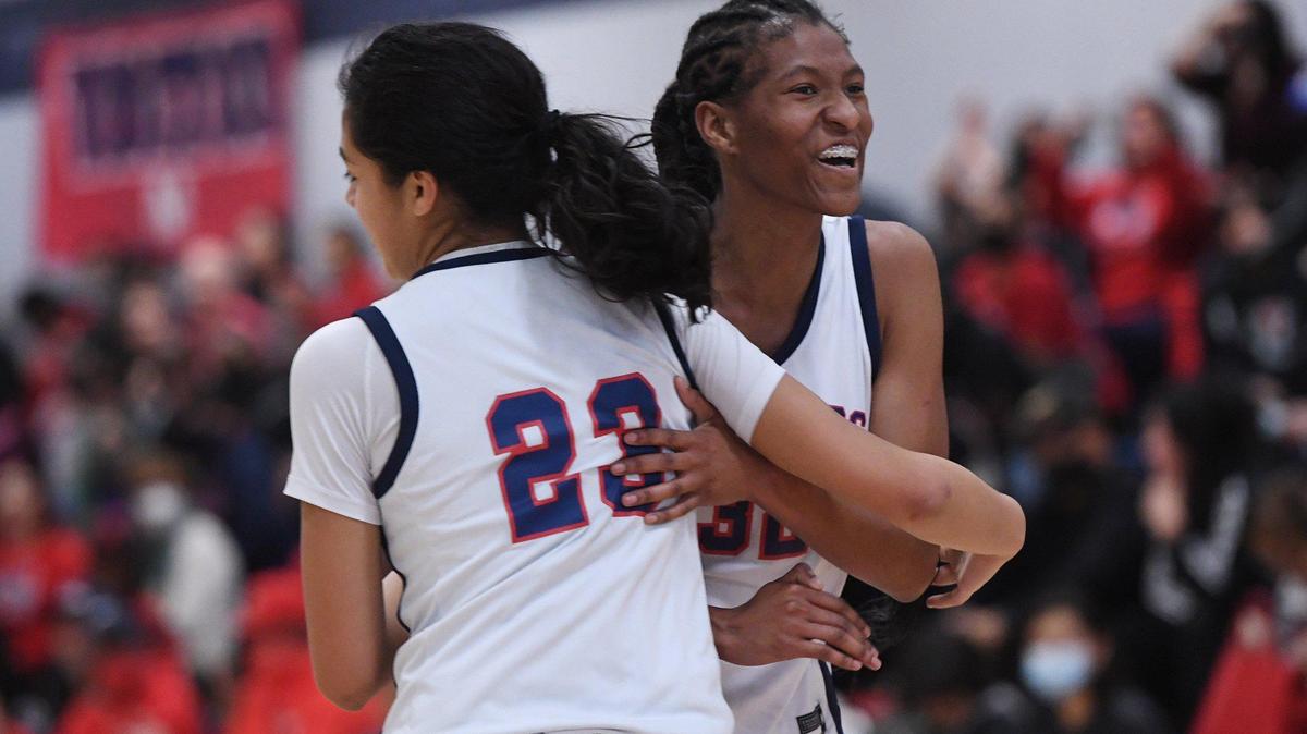 San Joaquin Memorial’s Gabby Ramos, left, and Meadow Roland, right, as they take on Clovis East Friday, Feb. 18, 2022 in Fresno.
