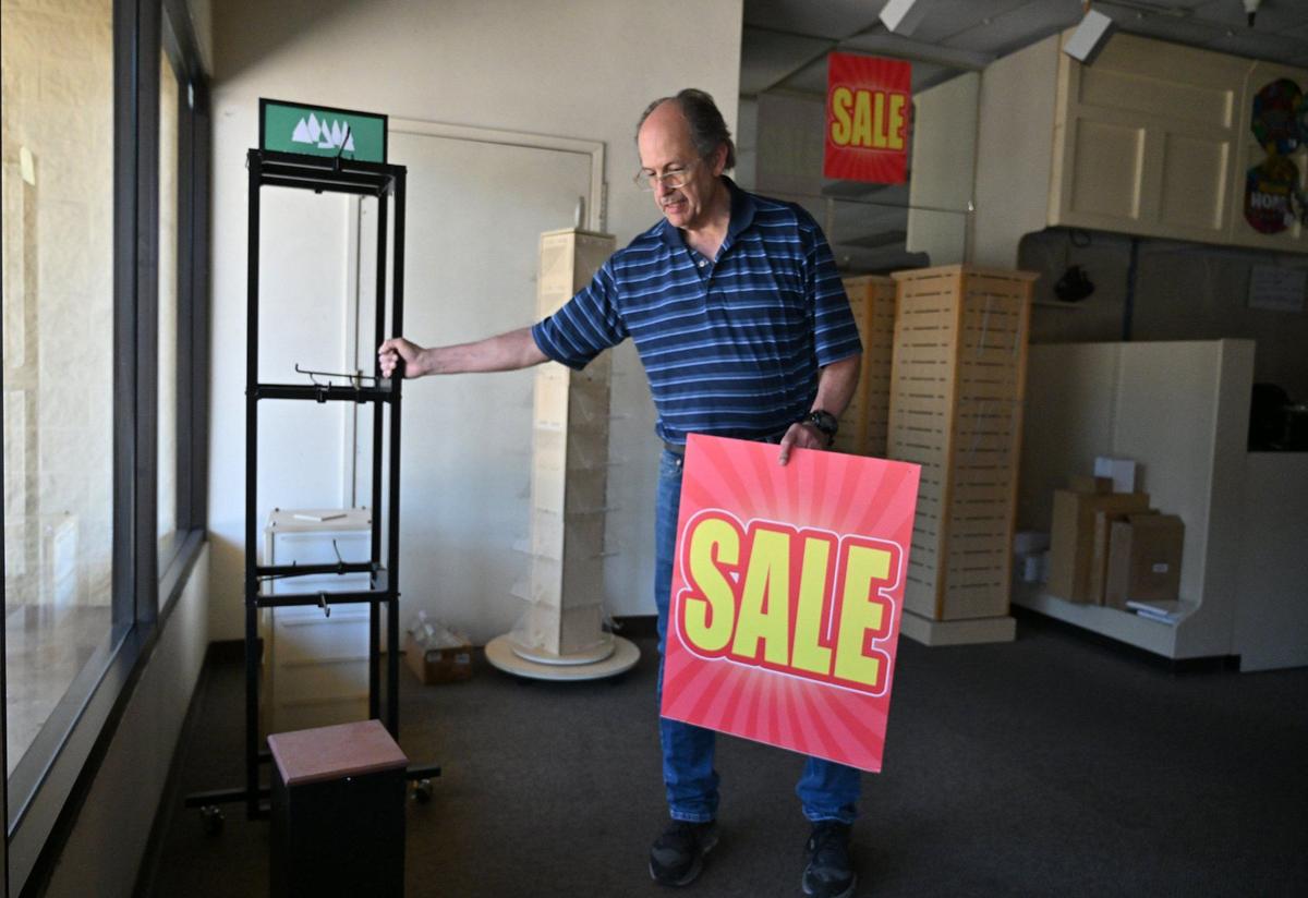 Tom Pearce, owner of Margie’s Hallmark Shop, clears out the store his parents opened 37 years ago near Clovis Avenue and Kings Canyon Road Friday in Fresno. After decades of service, Pearce has closed the shop.
