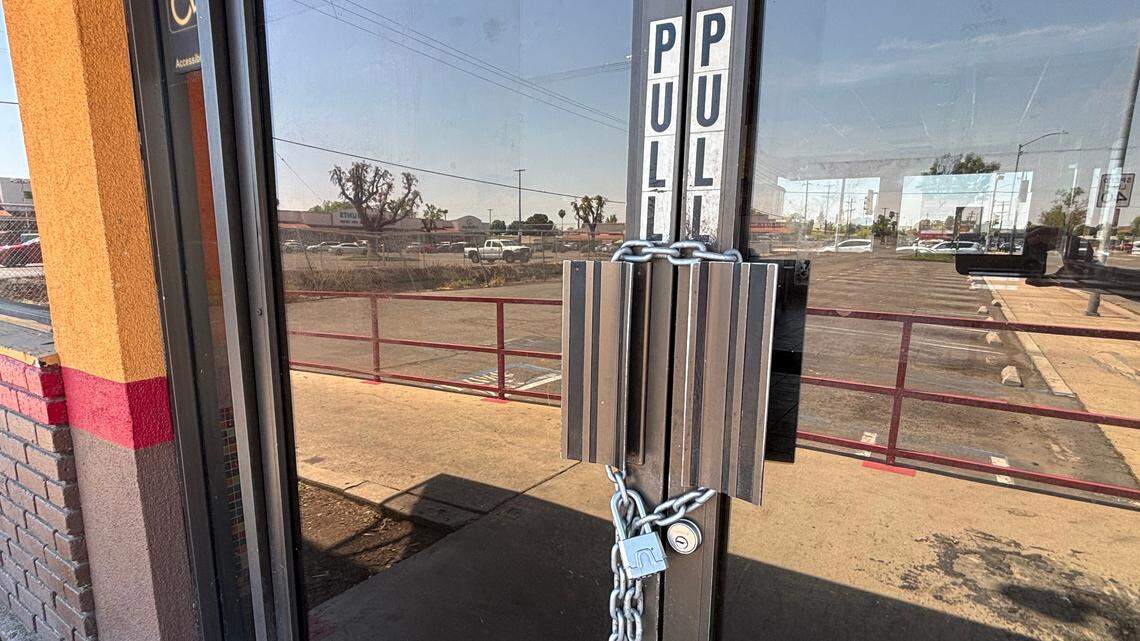 The doors are chained and locked at a Popeye’s location in Fresno.