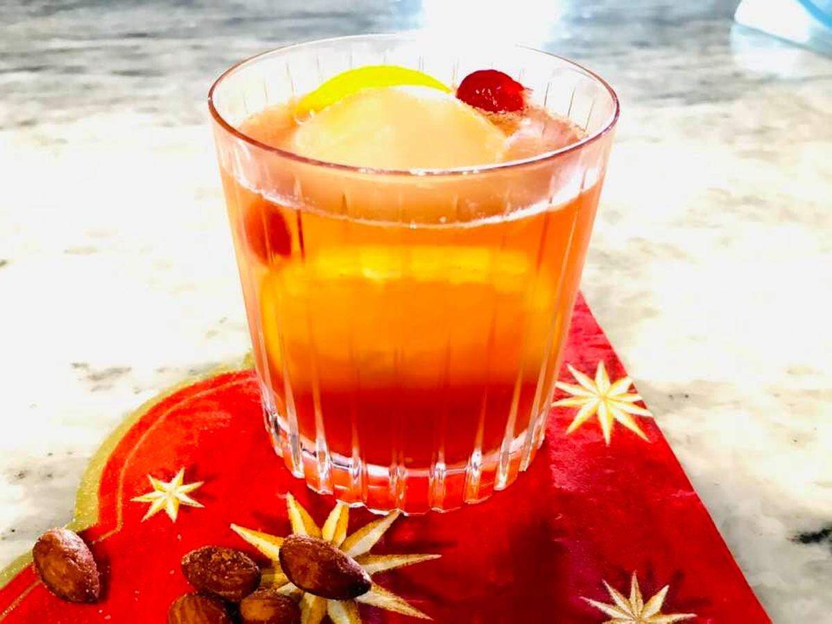 This twist on an Old Fashioned cocktail uses maraschino cherries infused with cloves.