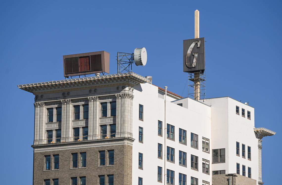 The G sign stands atop the Guarantee Savings Building in downtown Fresno on Tuesday, Nov. 28, 2023. The building was built in the 1920’s and is currently owned by the State Center Community College District. The SCCCD recently approved a project to replace the sign with a replica.