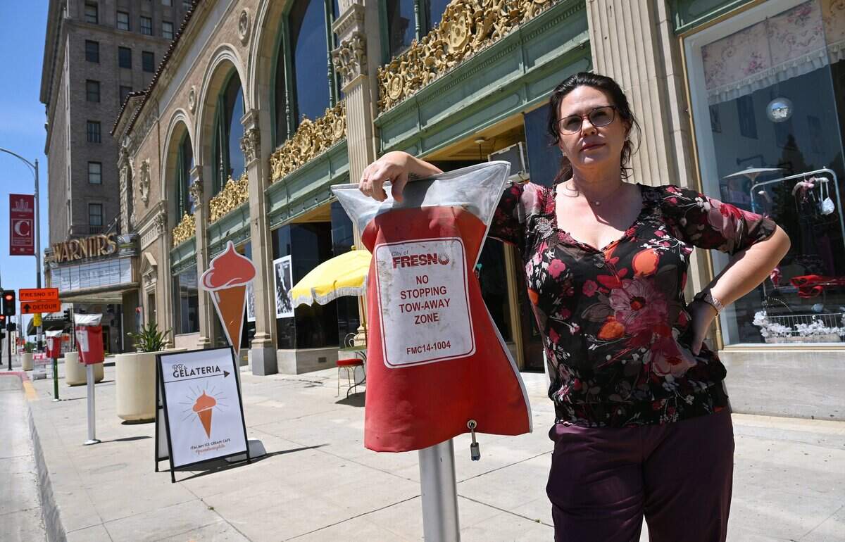 Stacy Williams, owner of BB Gelateria on Tuolumne Street, explains the parking challenges she and her customers face due to road closers and no parking zones including in front of her shop, during an interview Tuesday, May 12, 2026 in downtown Fresno.