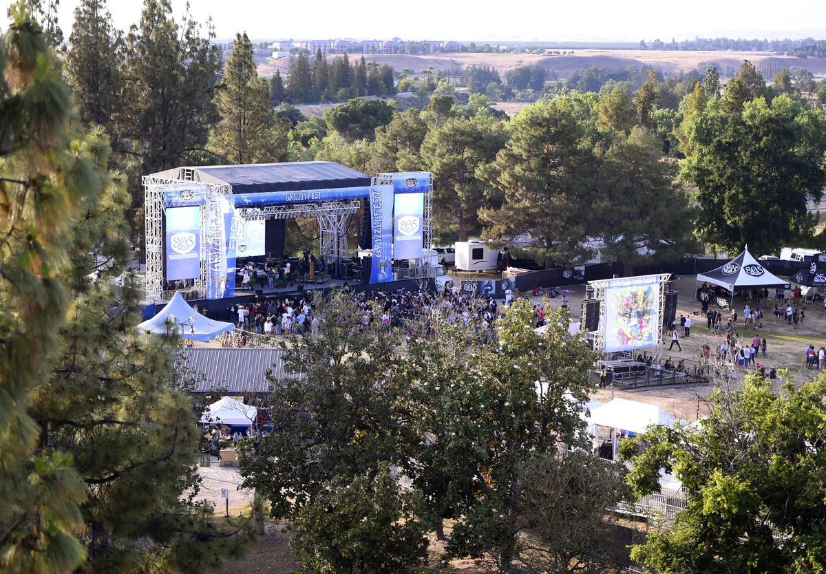 Yosemite stage, left, and others were situated among the trees at Woodward Park for Grizzly Fest 2018 Friday, May 18, 2018 in Fresno. Valley Children's Hospital can be seen in the far distance.