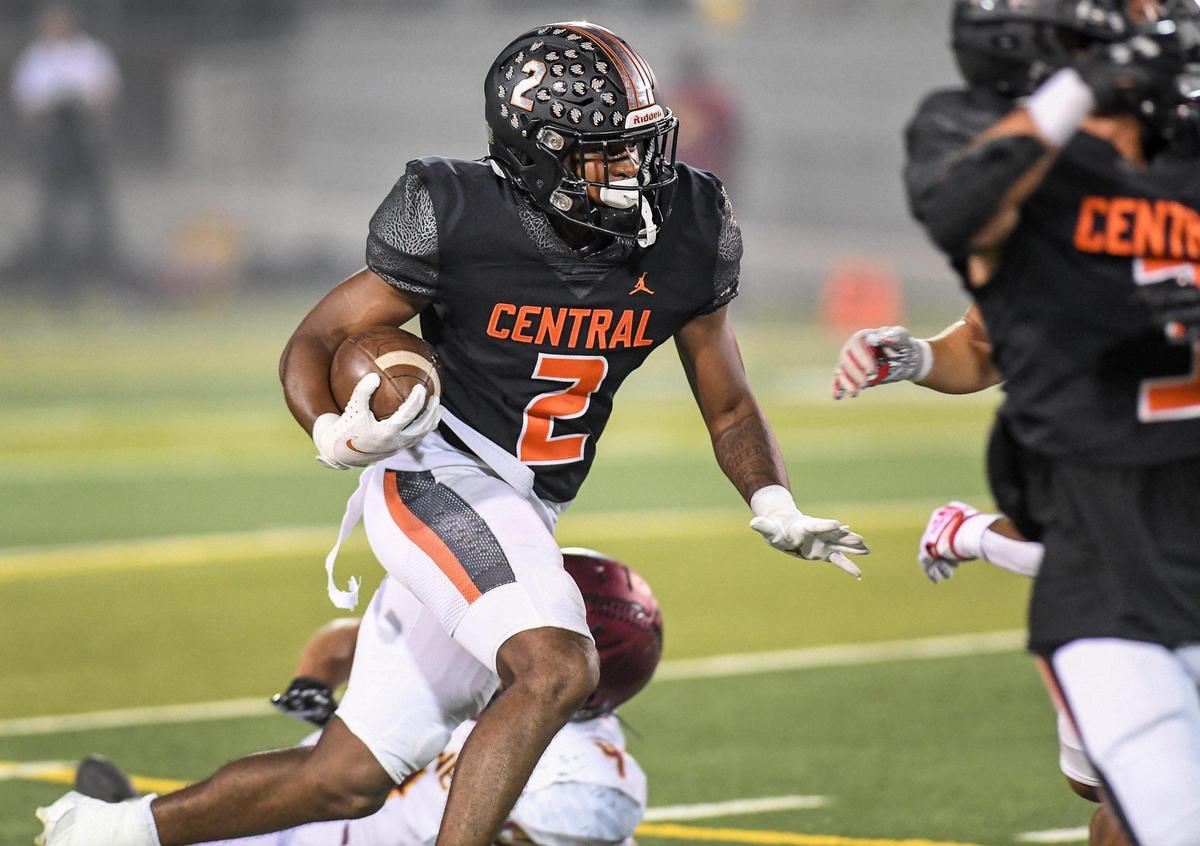 Central High’s LaDanian Streets takes the ball upfield before scoring the Grizzlies’s first touchdown of the game against undefeated Clovis West at Deran Koligian Stadium on Friday, Oct. 21, 2022.