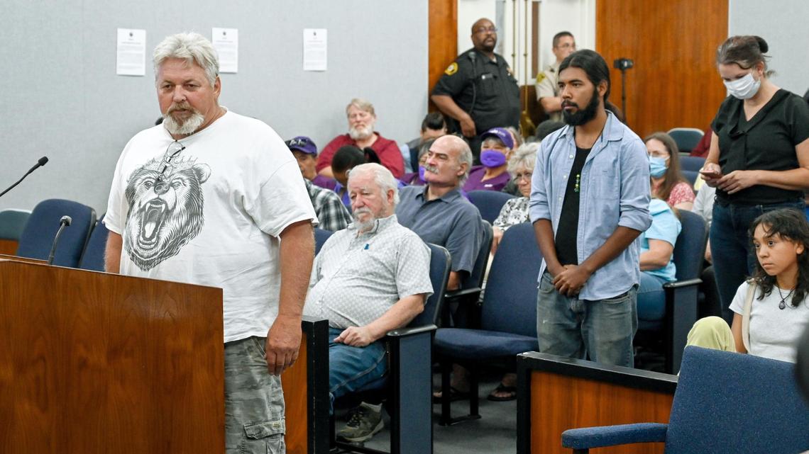 Speakers, including Squaw Valley resident Billy Melton, left, line up to discuss the renaming of Squaw valley during a public comment period for Fresno County Supervisor Nathan Magsig’s resolution during a meeting of the board of supervisors on Tuesday, Oct. 11, 2022.