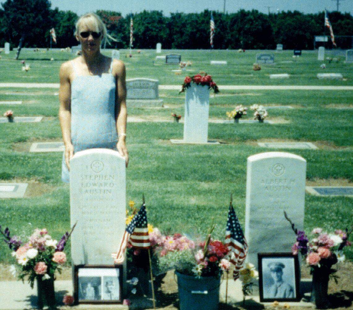 Neily Esposito at the grave of her father, Cpl. Stephen Austin, in Lindsay, CA.
