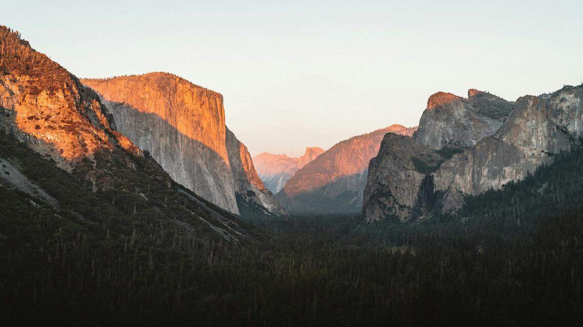 A former Yosemite National Park employee is charged in connection with raping one of his co-workers, federal officials say.