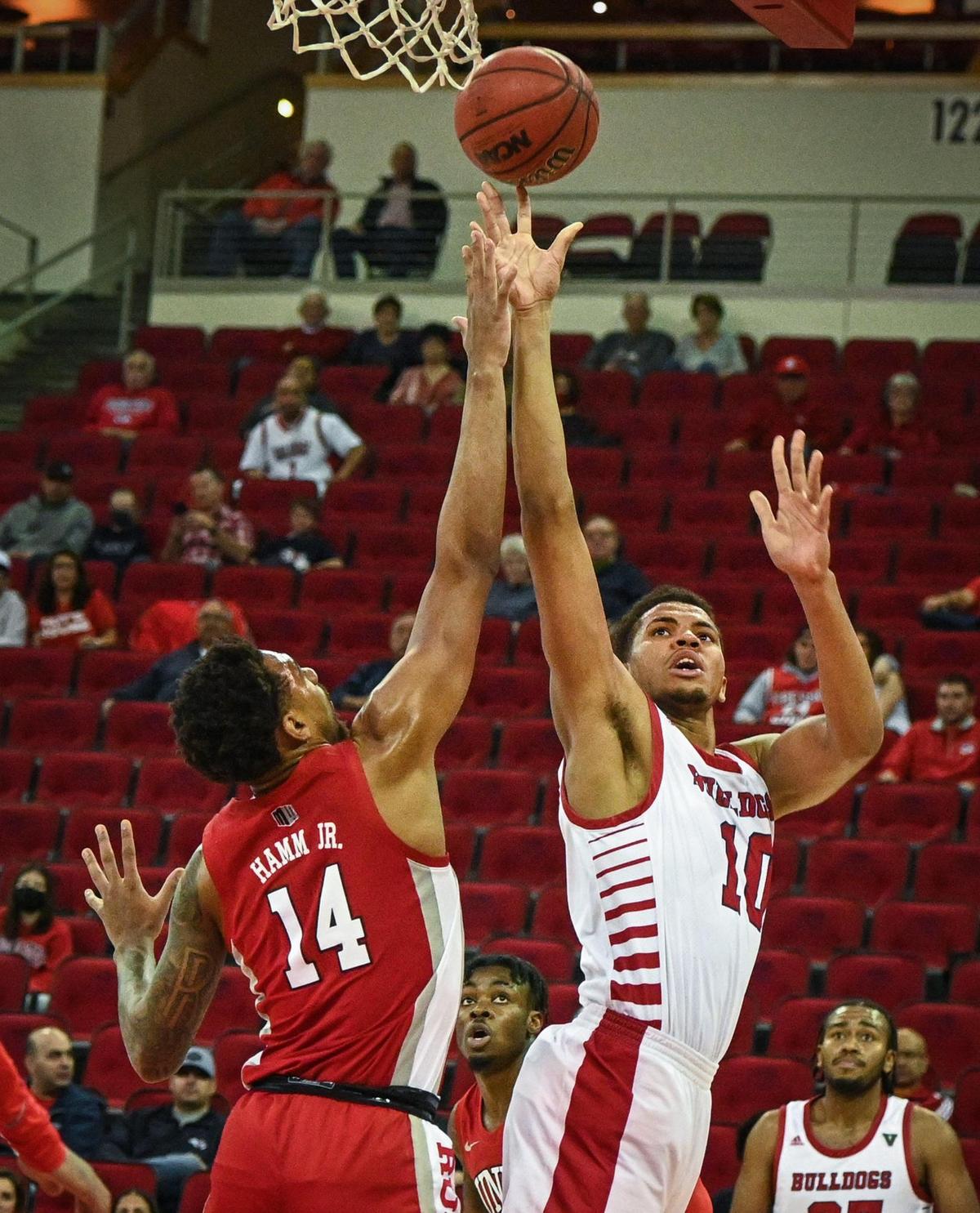 Fresno State’s Orlando Robinson puts up a shot as UNLV’s Royce Hamm Jr. tries to block it during their game at the Save Mart Center in Fresno on Wednesday, Feb. 16, 2022.
