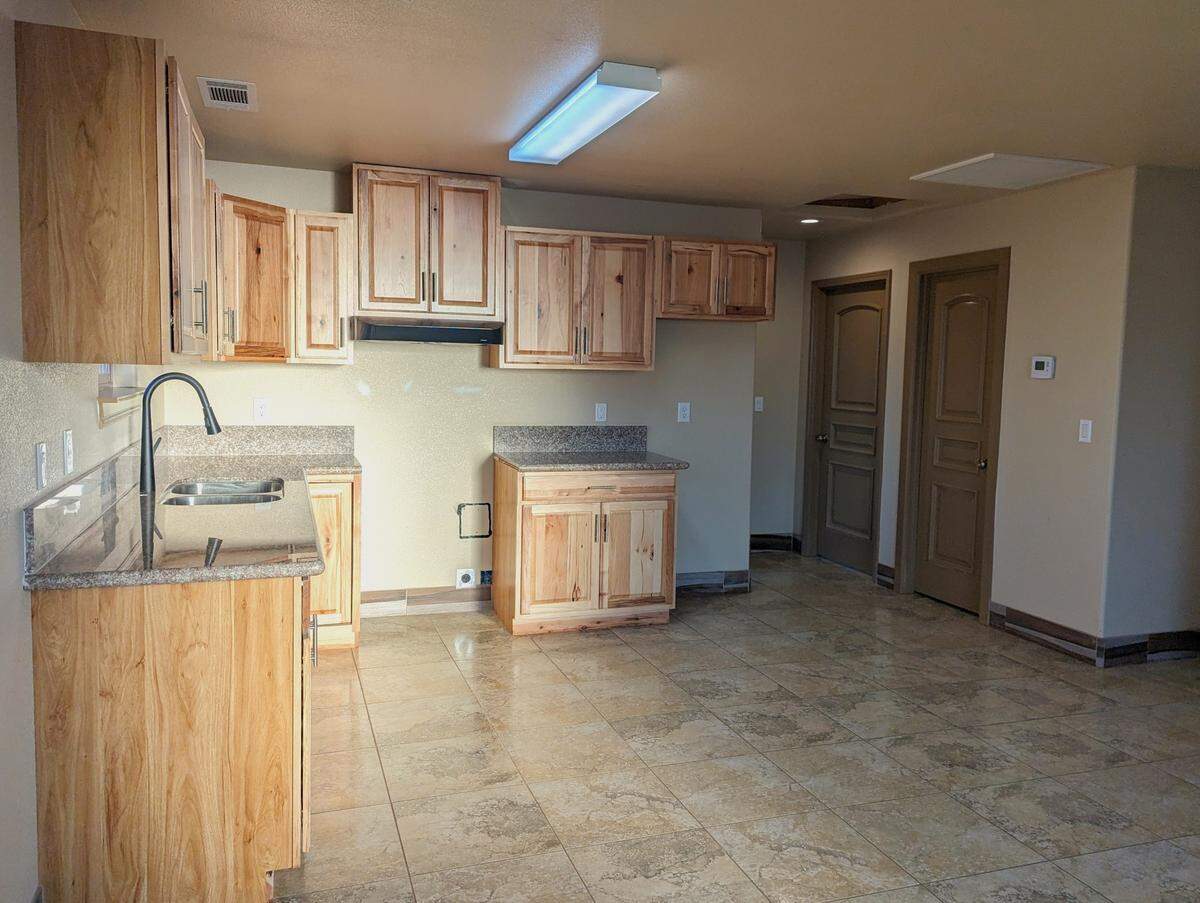 The kitchen area is seen inside an ADU that architect Ubaldo Garcia designed in Madera. He has designed a standard ADU plan that he says will work anywhere in the city.