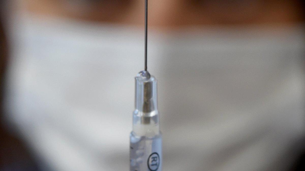 A Pfizer vaccine is prepared during a clinic at the Tipton Library, July 29, 2021.