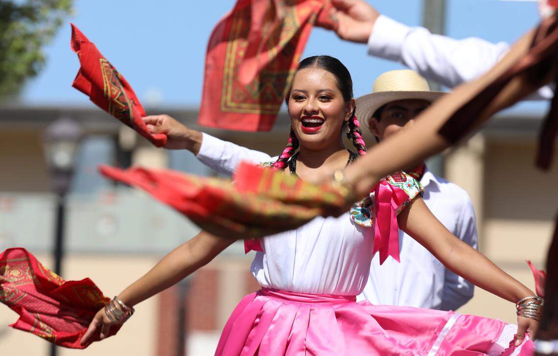 A dancer with Ballet Folklórico Nueva Antequera performs Sones y Chilenas de San Juan Cacahuatepec from the costal region of Oaxaca, México during the Guelaguetza Fresno held Sept. 28, 2025 at Fresno City College.