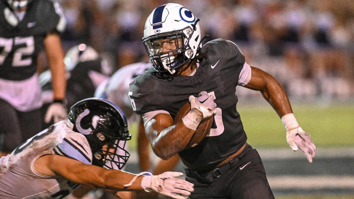 Central Valley Christian’s Bryson Donelson runs past the Clovis North defense during their game at CVC on Friday, Sept. 8, 2023.
