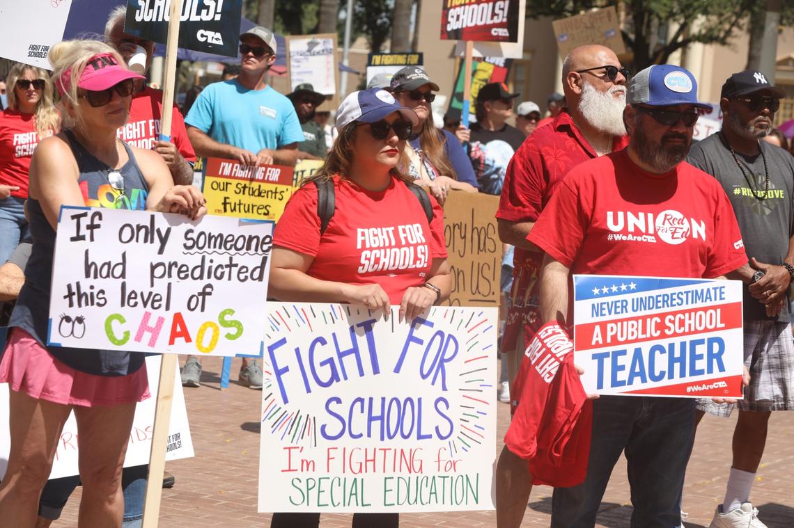 Central Valley educators, families, students and supporters demand U.S. Rep. David Valadao to defend funding for valley schools and urge the Republican congressman to oppose federal cuts to public education on May 17 in Hanford CA.