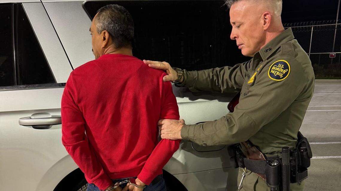 A Border Patrol agent makes an arrest during an immigration enforcement action in the Bakersfield area in a Facebook post on Friday.