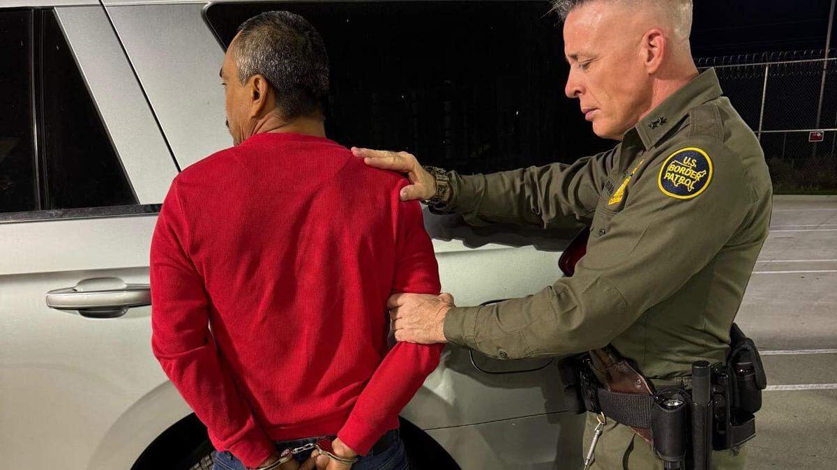 A Border Patrol agent makes an arrest during an immigration enforcement action in the Bakersfield area in a Facebook post on Friday.