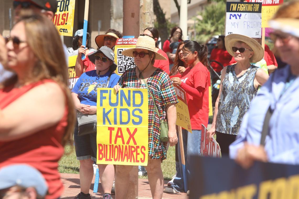 Central Valley educators, families, students and supporters demand U.S. Rep. David Valadao to defend funding for valley schools and urge the Republican congressman to oppose federal cuts to public education on May 17 in Hanford CA.