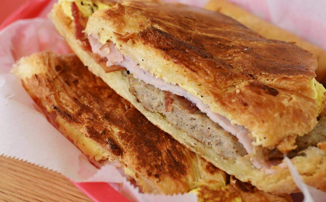 A Breakfast Sausage, Egg and Ham croissant is seen at City Donuts in the former Supreme Donuts location at the corner of Palm and McKinley avenues Wednesday, Oct. 22, 2025 in Fresno.