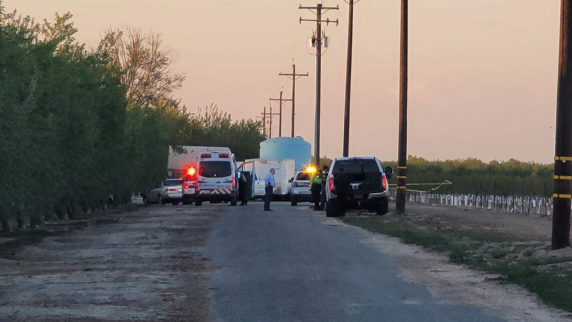 Fresno County Sheriff’s investigators work at the scene of a shooting between Kingsburg and Caruthers on Thursday evening, March 17, 2022.