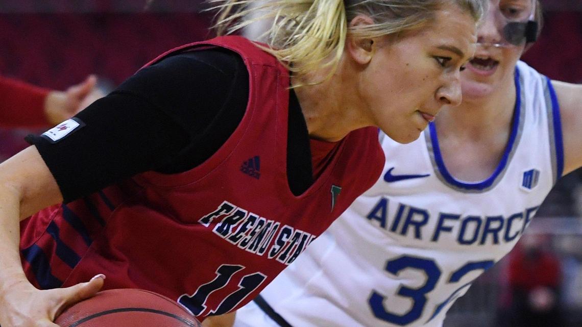 Fresno State’s Maddi Utti, foreground, drives against Air Force in a Feb. 11 game. Utti had 19 points and seven rebounds Sunday, Feb. 21, in an 82-61 win at San Diego State.