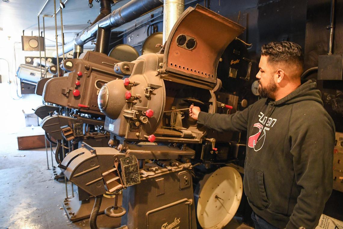 Rich Juarez, technical director at Warnors Theatre in downtown Fresno, explains how the old carbon arc projectors worked in the projector booth at the theater on Thursday, Nov. 11, 2021. Warner Bros. screened movies at the theatre from the 1930s into the 1960s using the projectors, which have been there ever since.