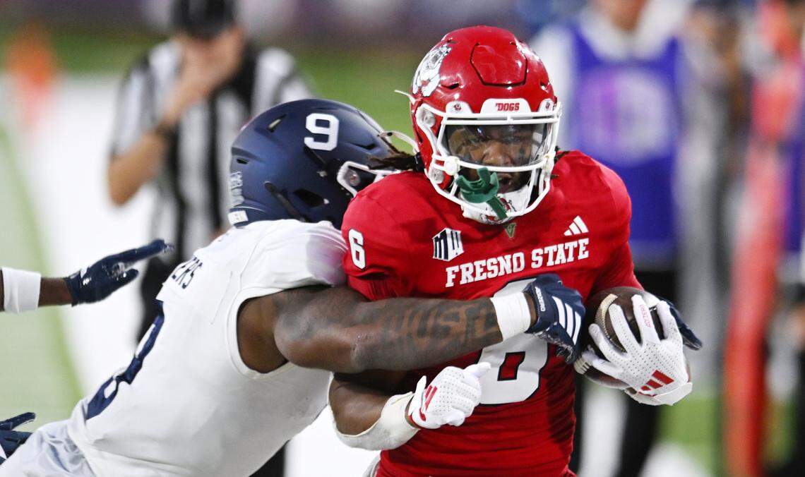 Fresno State's Bryson Donelson is forced out of bounds by Georgia Southern's Justin Meyers, left, Saturday, Aug. 30, 2025 in Fresno.