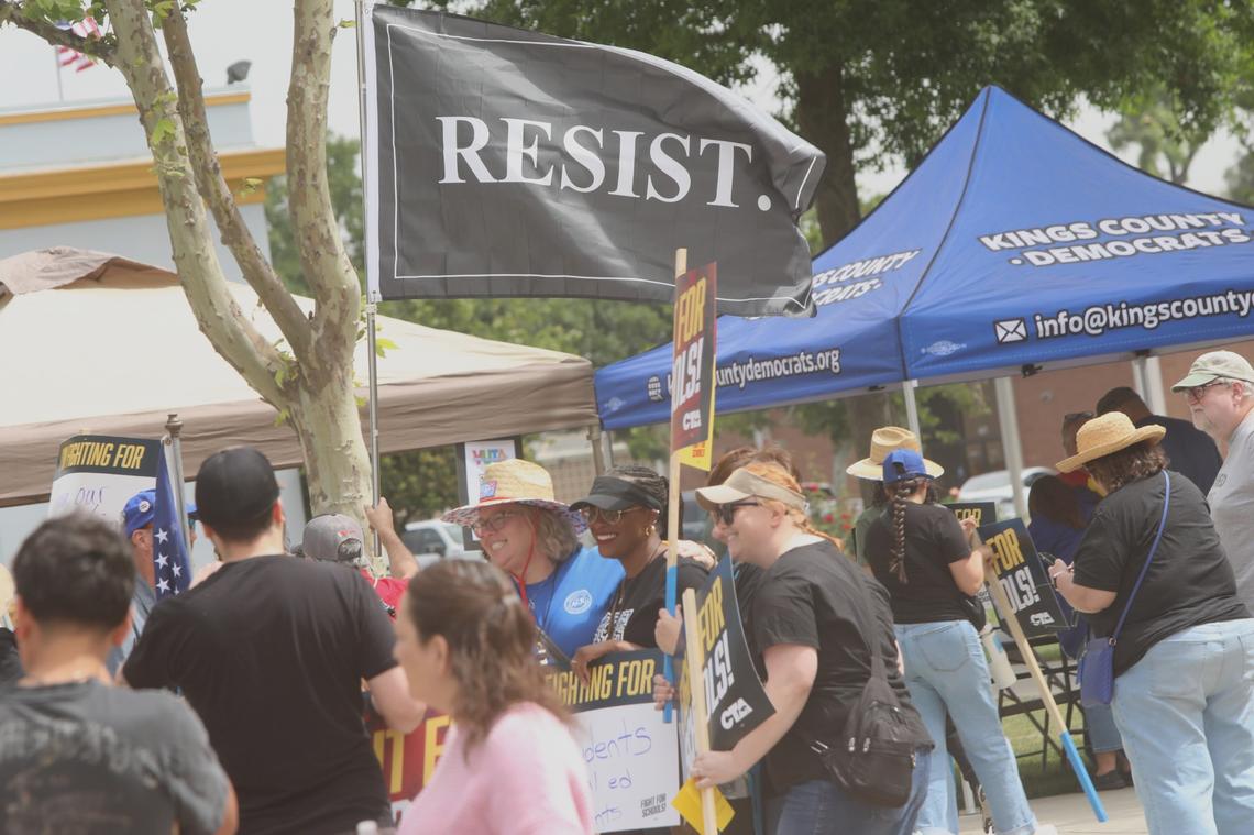 Central Valley educators, families, students and supporters demand U.S. Rep. David Valadao to defend funding for valley schools and urge the Republican congressman to oppose federal cuts to public education on May 17 in Hanford CA.
