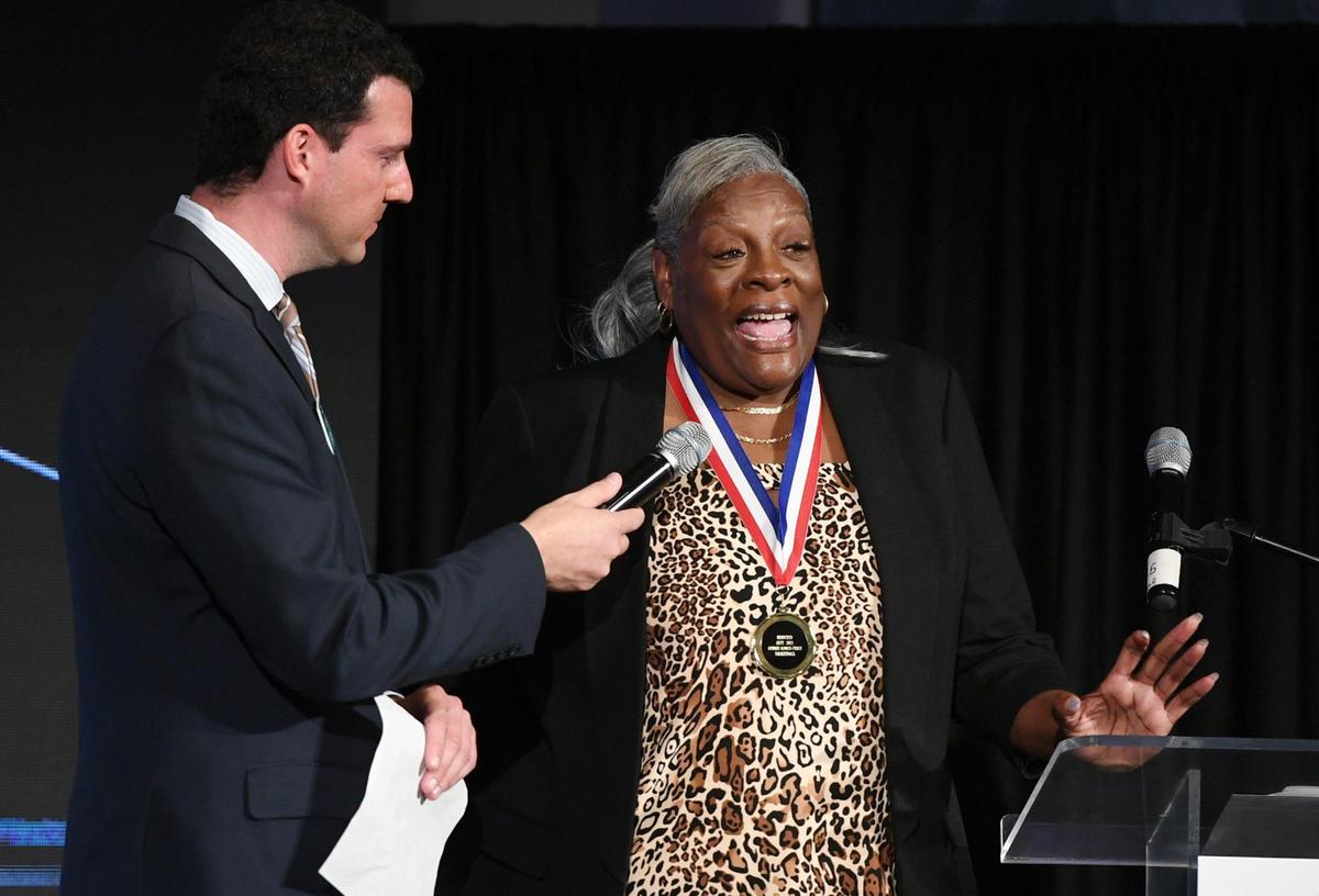 2022 inductee Connie Gooch, right, talks about her time playing on the winning Hoover Girls basketball team at the 63rd Annual Fresno County Athletic Hall of Fame Enshrinement Night Wednesday, Sept. 21, 2022 in Fresno. The event was also the grand opening in Athletic Hall of Fame’s new location inside the Save Mart Center at Fresno State.