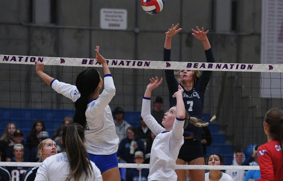Buchanan’s Savanna FauntLeRoy, center, sets the ball for Jemma Nelson, left, to spike against Central Valley Christian’s Karlee De Groot, background, in the Central Section’s DII Girls Volleyball Championship Thursday, Nov. 3, 2022 in Clovis. The Buchanan Bears won the final fifth game after both teams went 2-2.