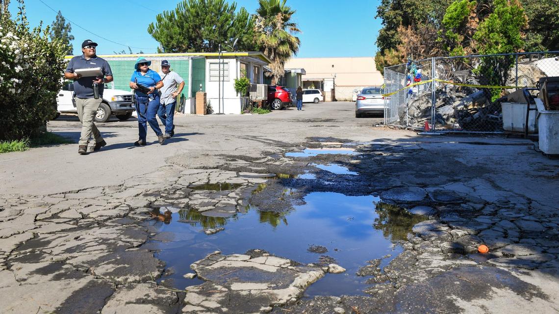 City of Fresno code enforcement officers look over homes at Trails End Mobile Home Park in Fresno on Monday, June 28, 2021. The City of Fresno sent a team of code enforcement officers along with investigators from the city police and fire departments to conduct an inspection of the park on Monday.
