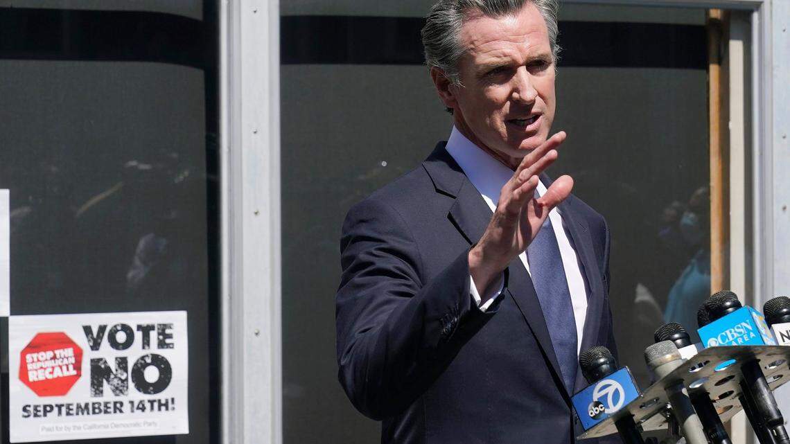 Gov. Gavin Newsom speaks to reporters in San Francisco, Tuesday, Sept. 14, 2021.