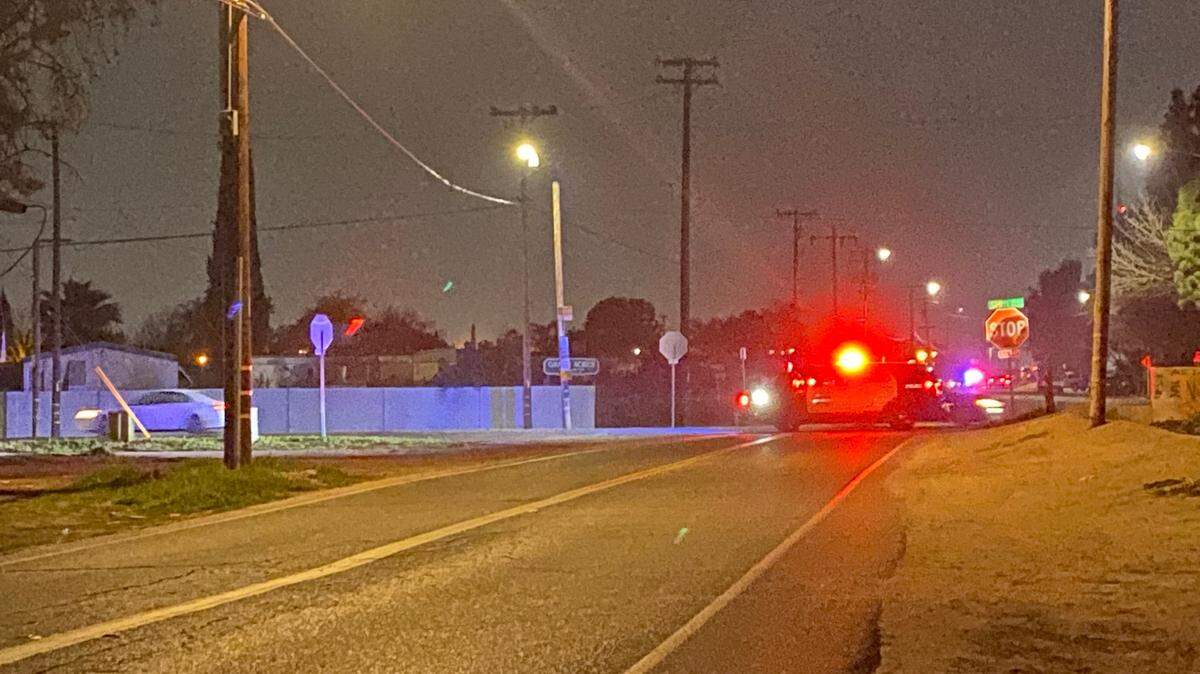 Fresno, California police blocked off the intersection of West Shields and North Valentine avenues after two men, wanted for home invasion robbery, were seen going inside an apartment on Wednesday, Feb. 2, 2022.