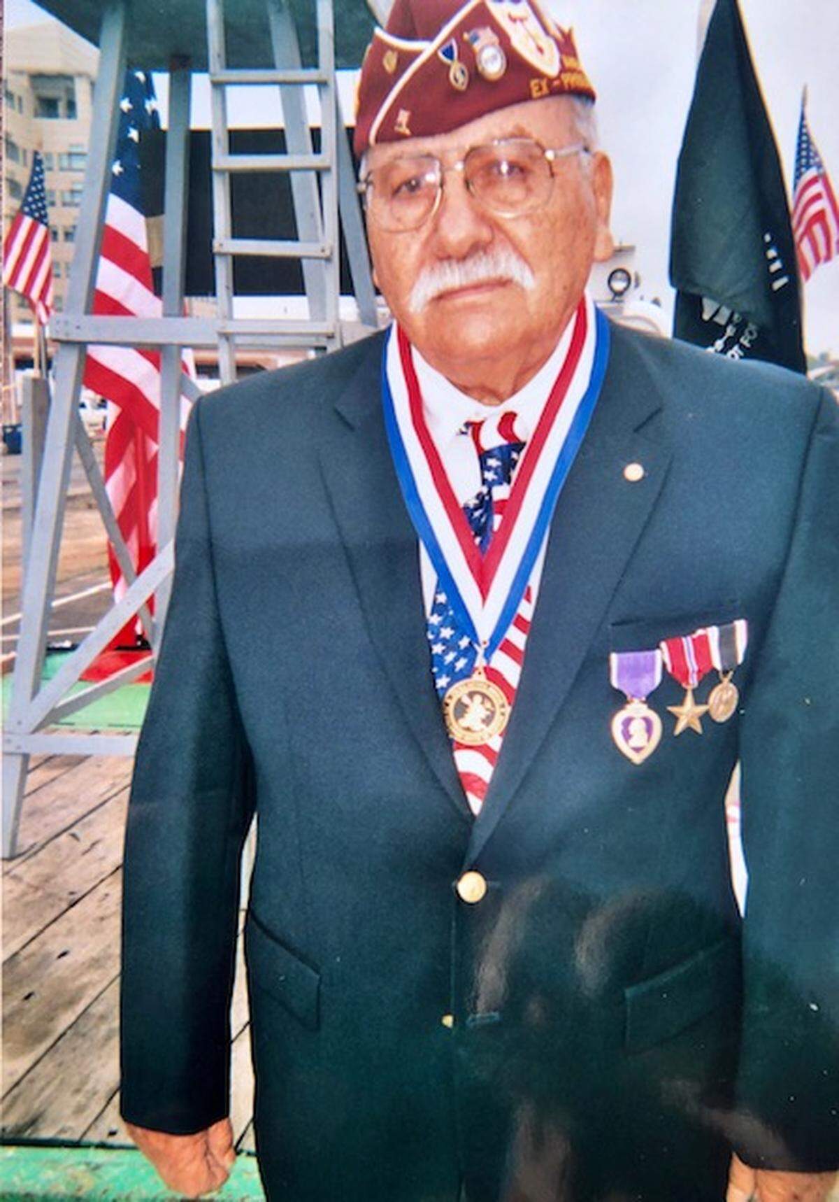 World War II veteran Pasqual Reyes atop the POW float at the Central Valley Veterans Day Parade in Fresno.