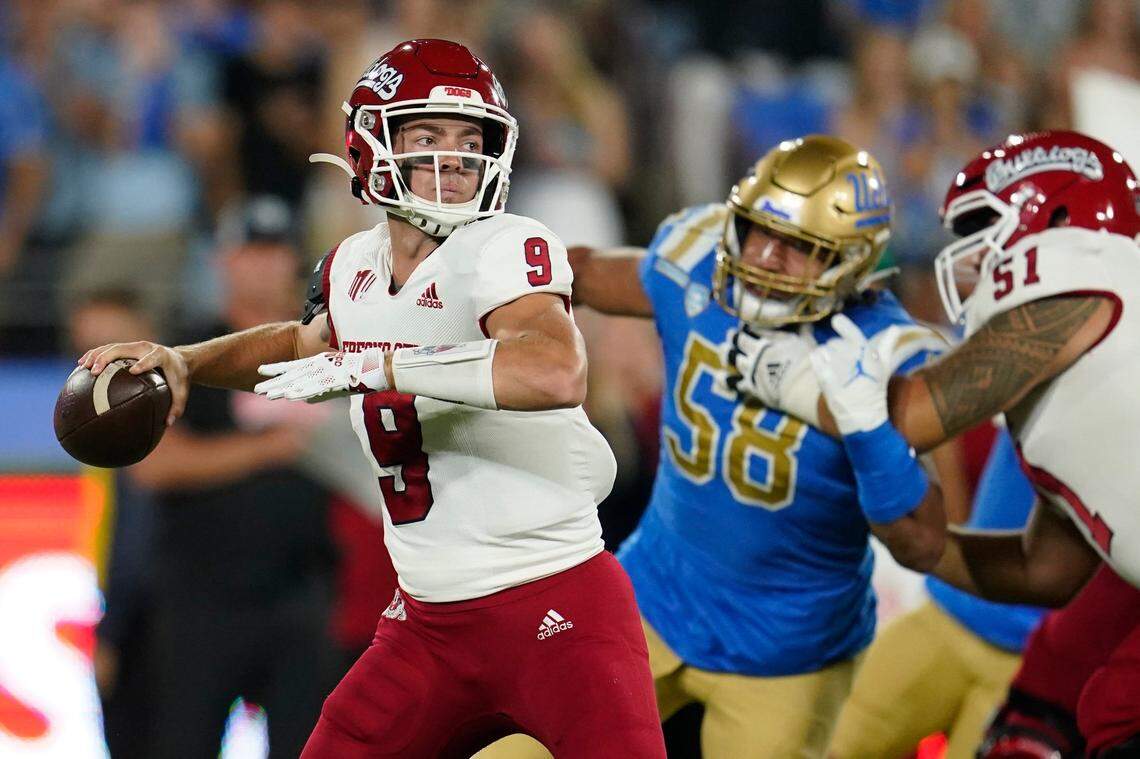 Fresno State quarterback Jake Haener looks for a receiver during the first half of the team’s NCAA college football game against UCLA on Saturday, Sept. 18, 2021, in Pasadena, Calif. (AP Photo/Marcio Jose Sanchez)