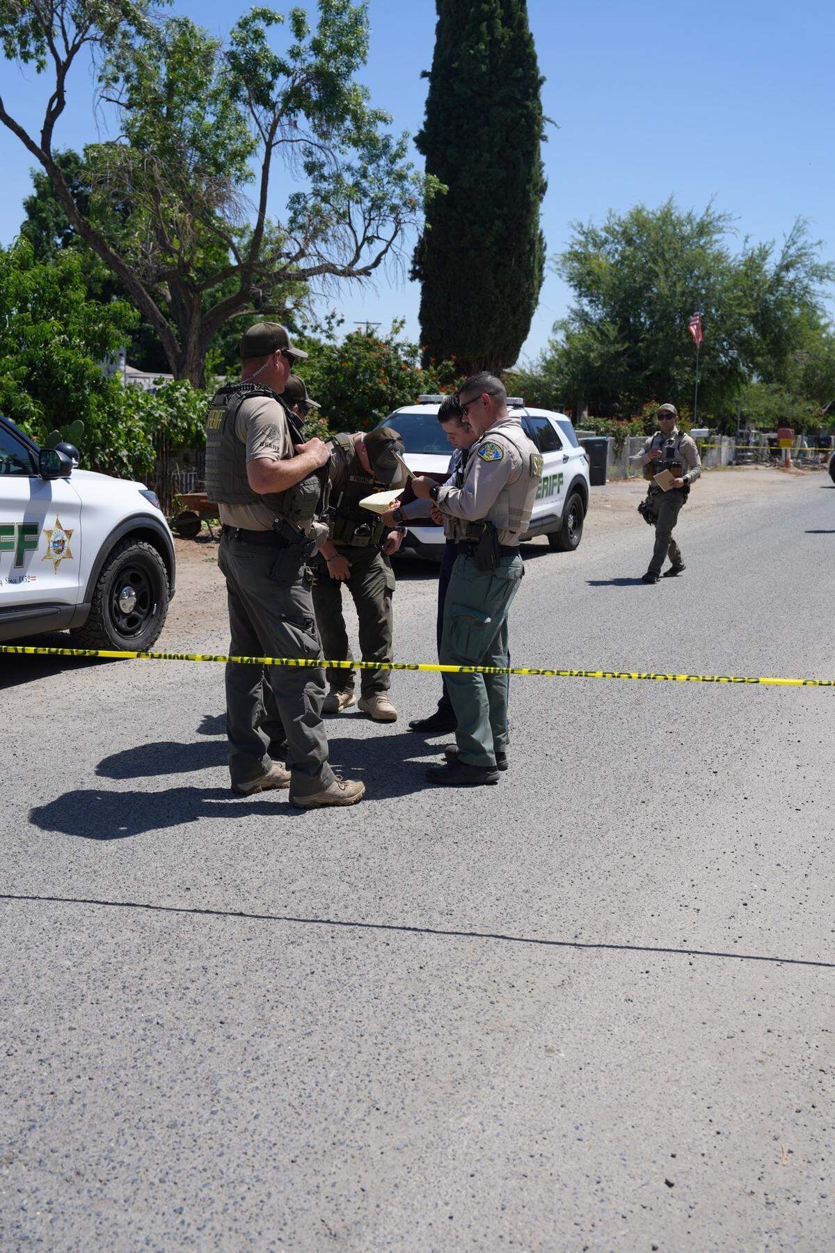 Tulare County law enforcement responds to the scene of a shooting Wednesday, May 20, 2026, in Tulare, California.