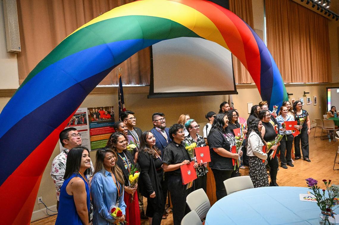 Graduates, staff, administrators and board members of the Rainbow Alliance Staff & Faculty Association gather for a group photo during the Rainbow Graduation Celebration at Fresno City College on Wednesday, May 7, 2025.
