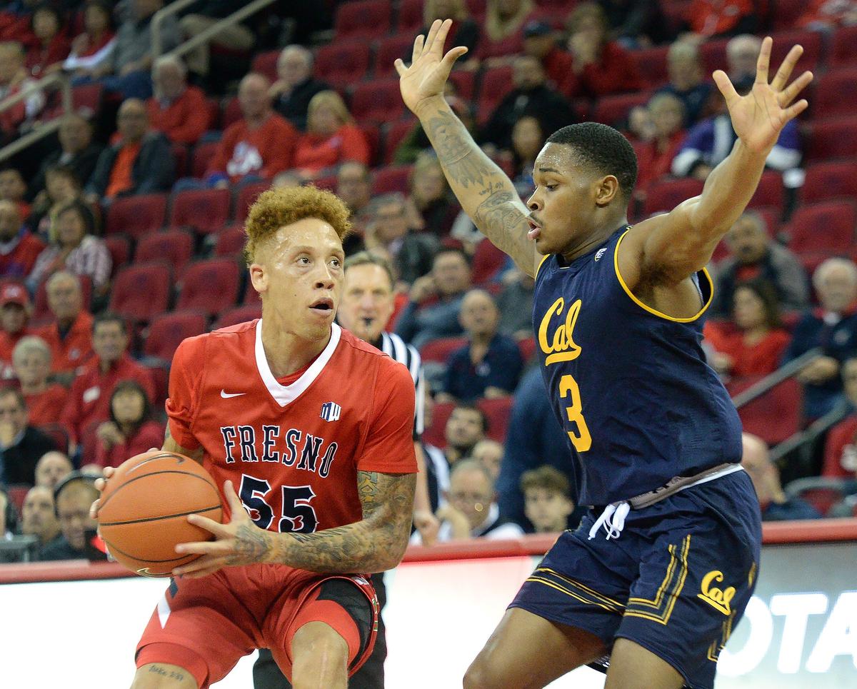 Fresno State guard Noah Blackwell, left, looks for an open shot while guarded by Cal’s Paris Austin during the Bulldogs’ 95-73 victory over the Golden Bears at the Save Mart Center on Wednesday, Dec. 19, 2018.