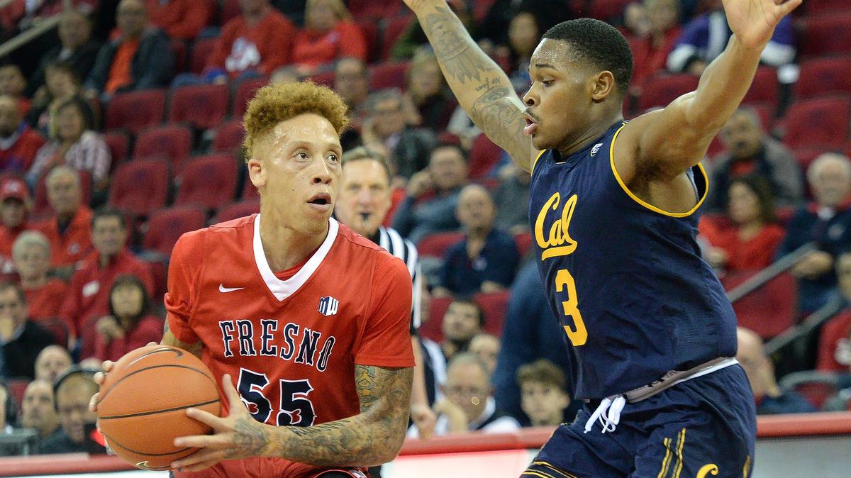 Fresno State guard Noah Blackwell, left, looks for an open shot while guarded by Cal’s Paris Austin during the Bulldogs’ 95-73 victory over the Golden Bears at the Save Mart Center on Wednesday, Dec. 19, 2018.