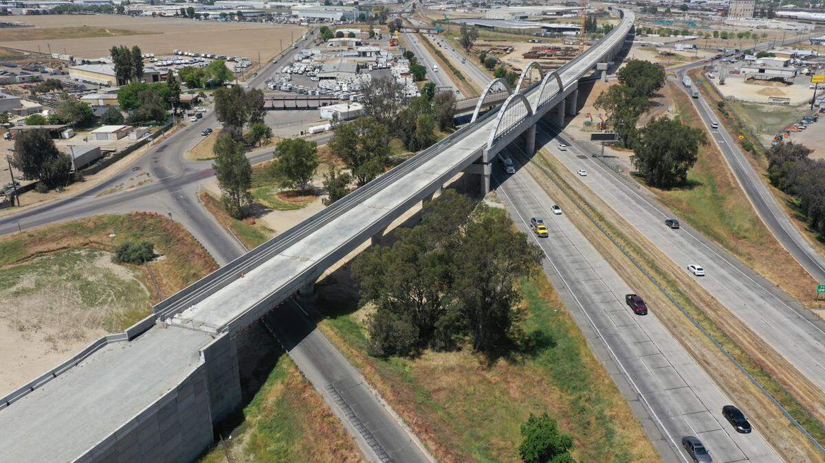 The 3,700-foot-long Cedar Viaduct for California’s high-speed rail project spans above Highway 99 and Cedar Avenue at the south end of Fresno in this photo looking north, taken April 25, 2023. The viaduct will carry high-speed trains on elevated tracks up and over traffic on the street and the highway. Completion of the structure was announced on May 10, 2023.