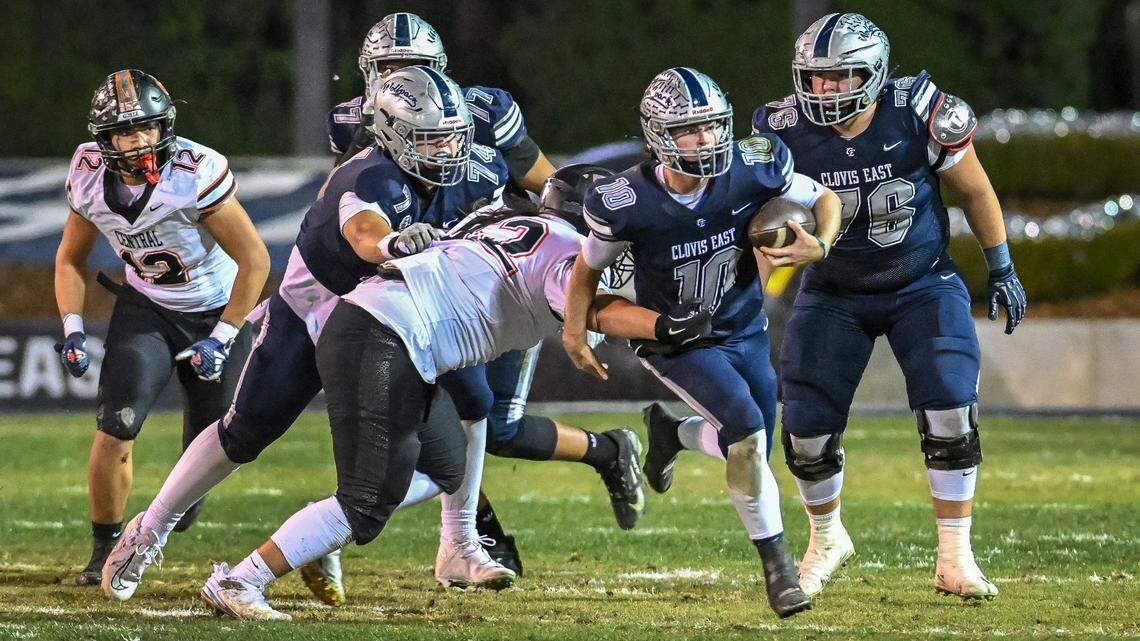 Clovis East quarterback Tyus Miller scrambles up the middle for a gain against Central during their Central Section Division 1-AA football championship game at Lamonica Stadium on Friday, Nov. 22, 2024.